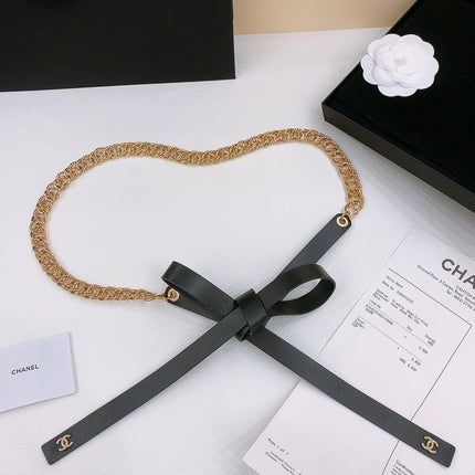RIBBED BOW WAIST CHAIN IN GOLD TONE BRASS AND BLACK LAMBSKIN