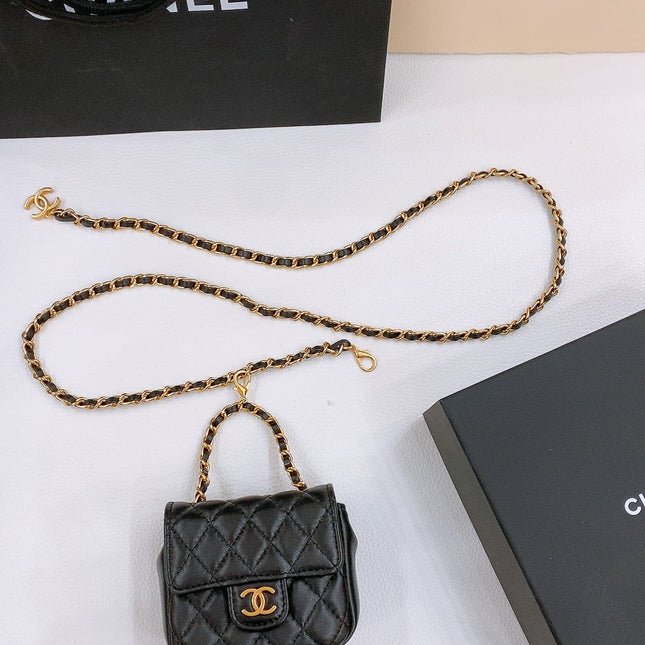 CHAIN BELT WITH GOLD METAL BLACK CALFSKIN INTERLINKING STRAPS AND MINI BAG