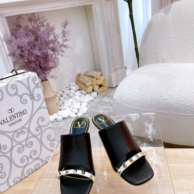 ROCKSTUD TOWER-HEEL MULES IN BLACK CALFSKIN 7 CM