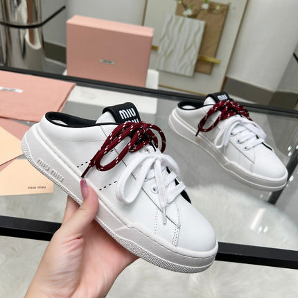 SNEAKER MULES IN BLACK AND WHITE CALFSKIN WHITE RED LACES