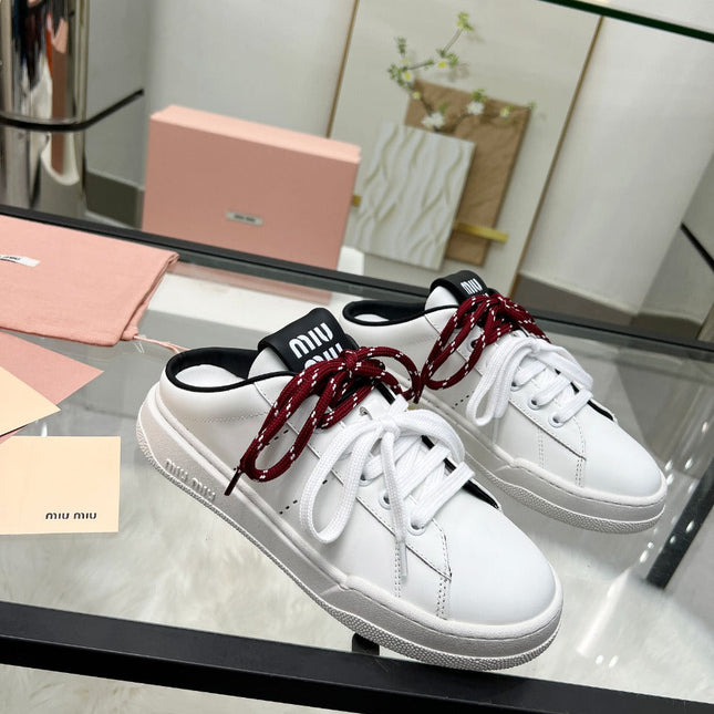 SNEAKER MULES IN BLACK AND WHITE CALFSKIN WHITE RED LACES