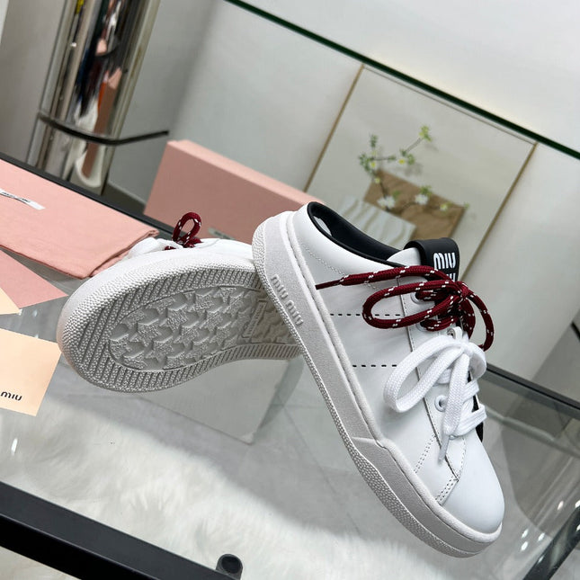 SNEAKER MULES IN BLACK AND WHITE CALFSKIN WHITE RED LACES