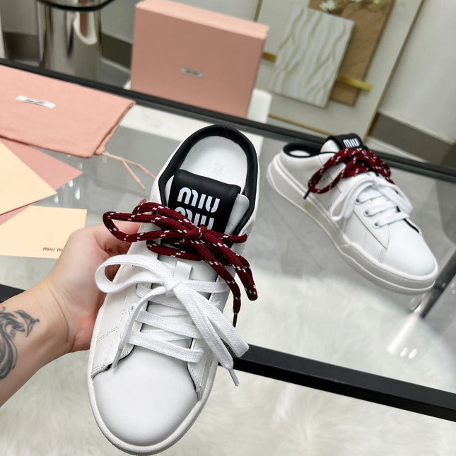 SNEAKER MULES IN BLACK AND WHITE CALFSKIN WHITE RED LACES